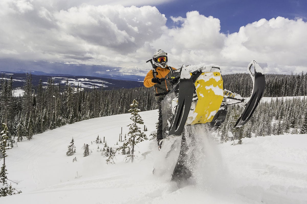 Snowmobiling in deep snow in British Columbia, Canada