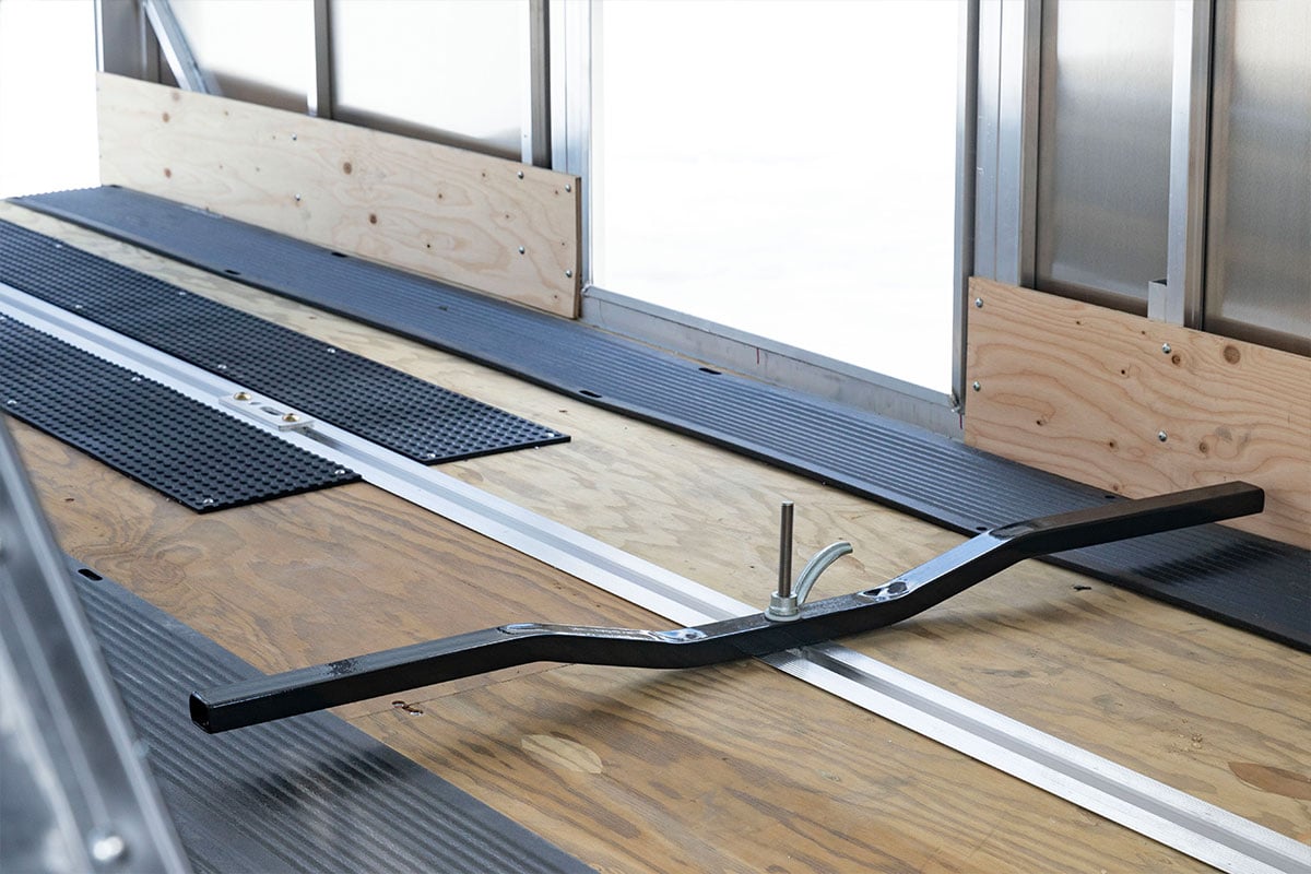 Crossover aluminum snow trailer interior with kick plate, tie-down bar, side access door open