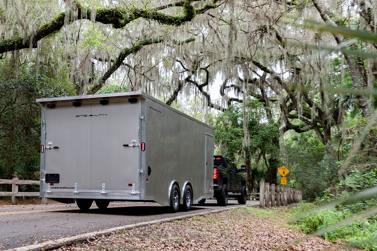 Enclosed aluminum trailer towed by a pickup in DeLand, Florida