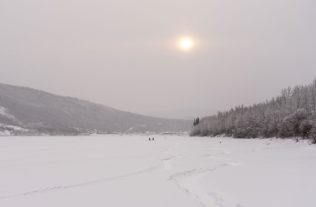Snowmobiles on a frozen river near Dawson City, Yukon Territory, Northern Canada