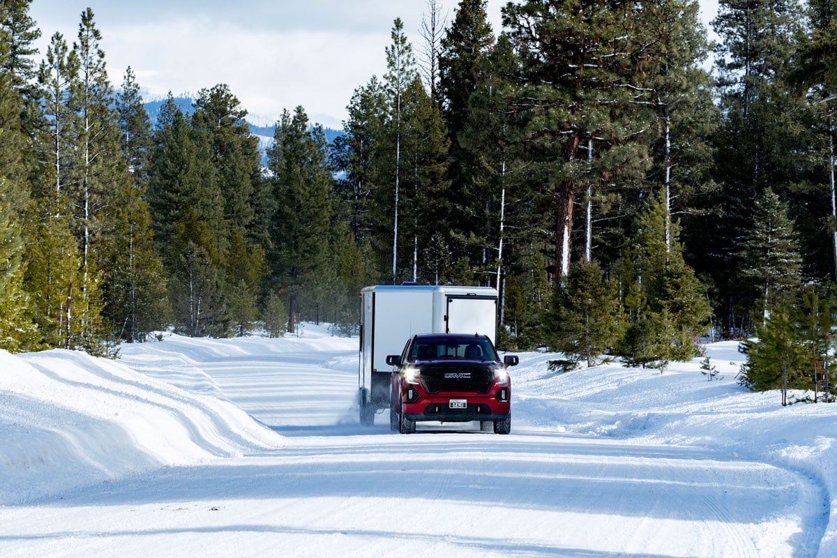 ALCOM-Elevation-Series-GCST-Red-Truck-Tows-White-Trailer-Thru-Snow-2