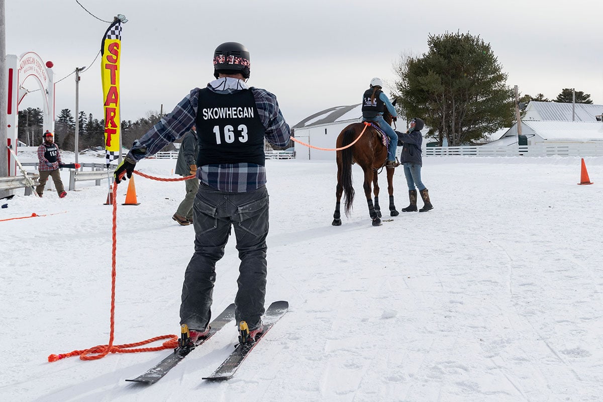 Skijor team Nate and Josie at the starting line for their championship run