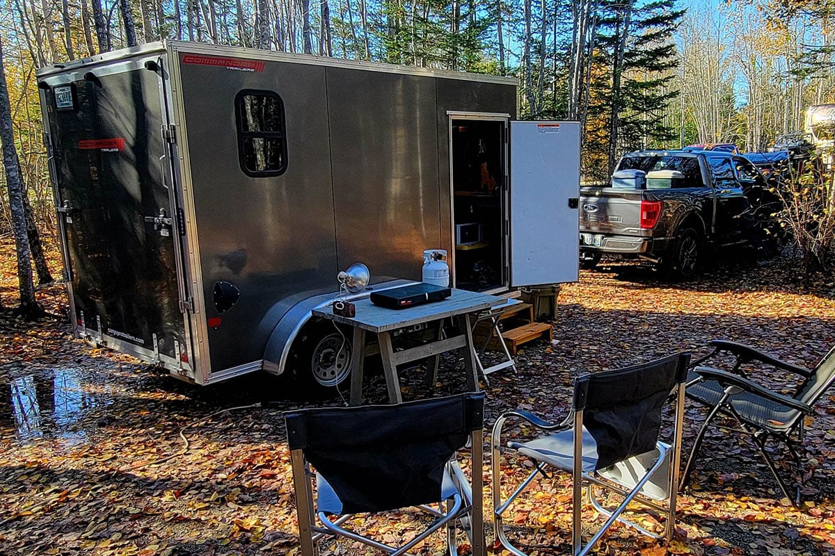 Ted's aluminum UTV/camper trailer parked at a New England campsite.