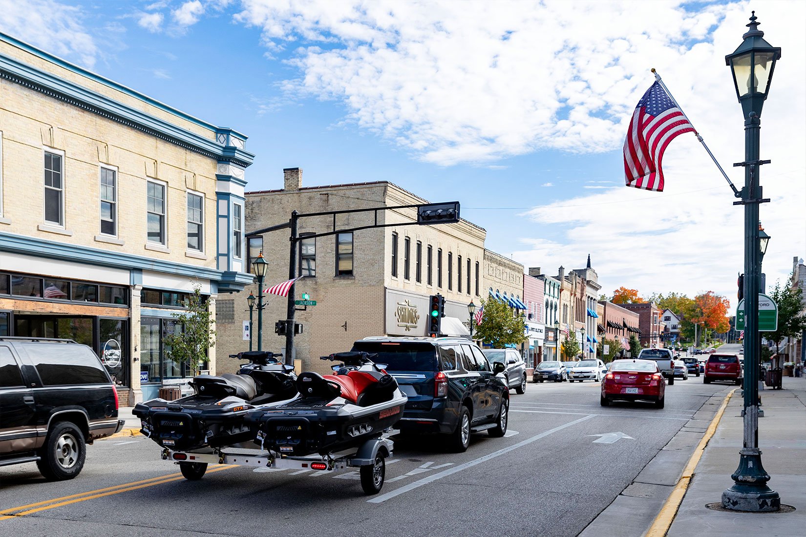 SUV towing an ALCOM Triton Elite aluminum PWC trailer