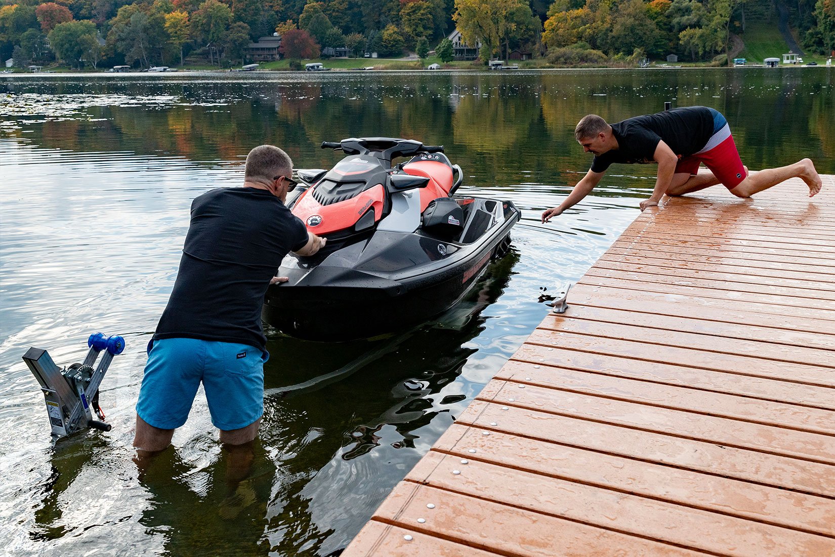 Unloading a PWC from a Triton Wave series aluminum trailer by ALCOM