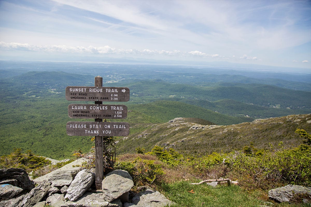 View from the top of Mt. Mansfield, VT, showing a sign at the peak.