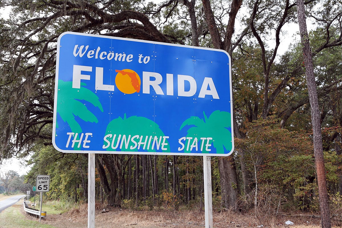 Welcome to Florida sign on the road at the state line
