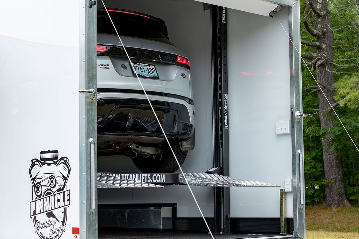 ALCOM's aluminum Pinnacle Stacker car trailer with a car on the Titan lift