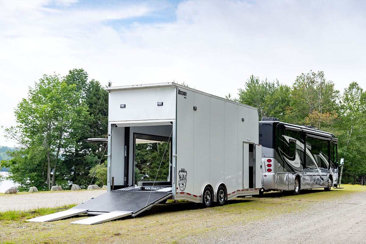 ALCOM's aluminum Pinnacle Stacker car hauler trailer with all the doors open