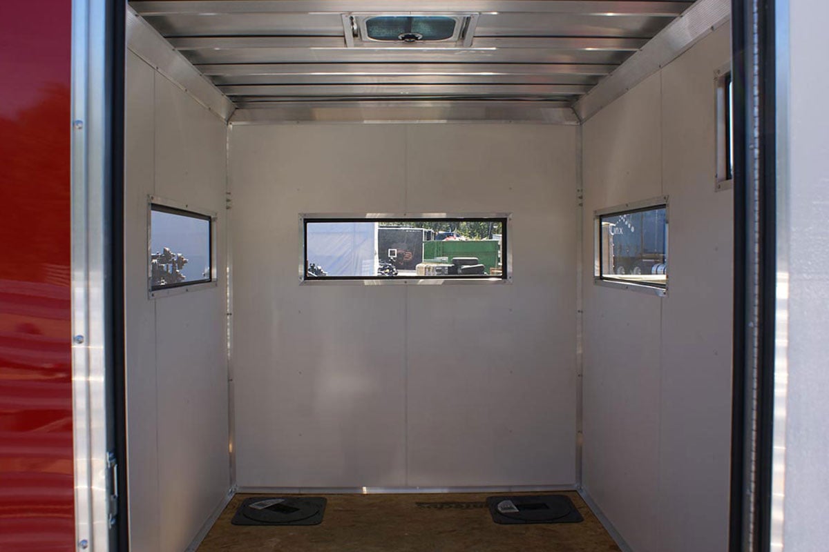 Insulated interior and floor holes for fishing in an aluminum ALCOM ice shack