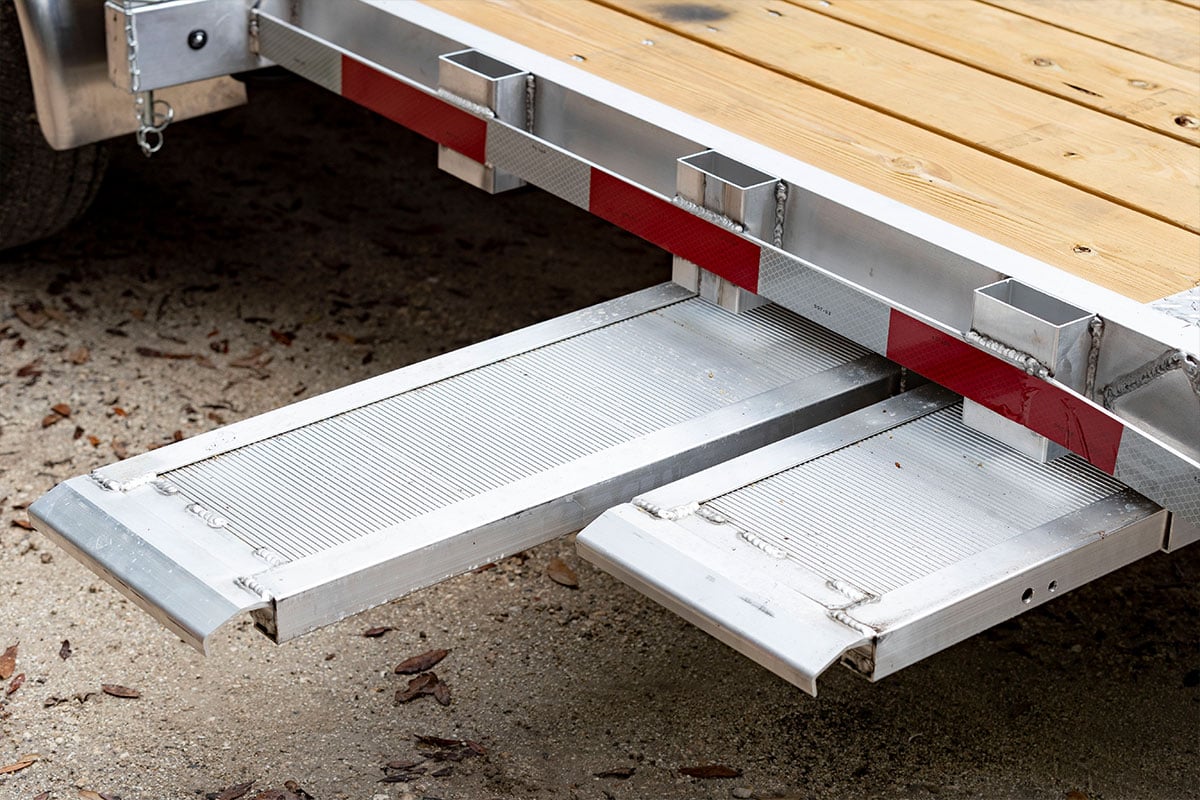 Stowable ramps on ALCOM wood deck open car hauler