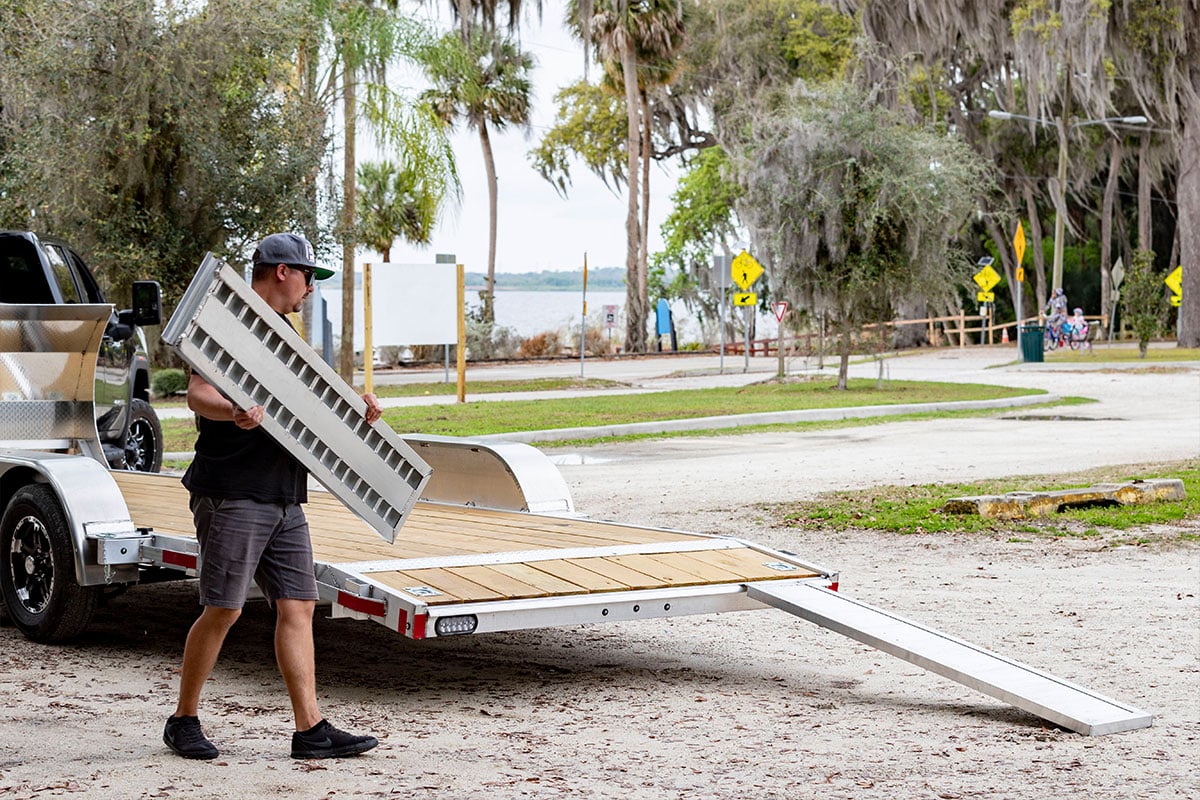 Setting up stowable ramps to load an open car trailer from ALCOM