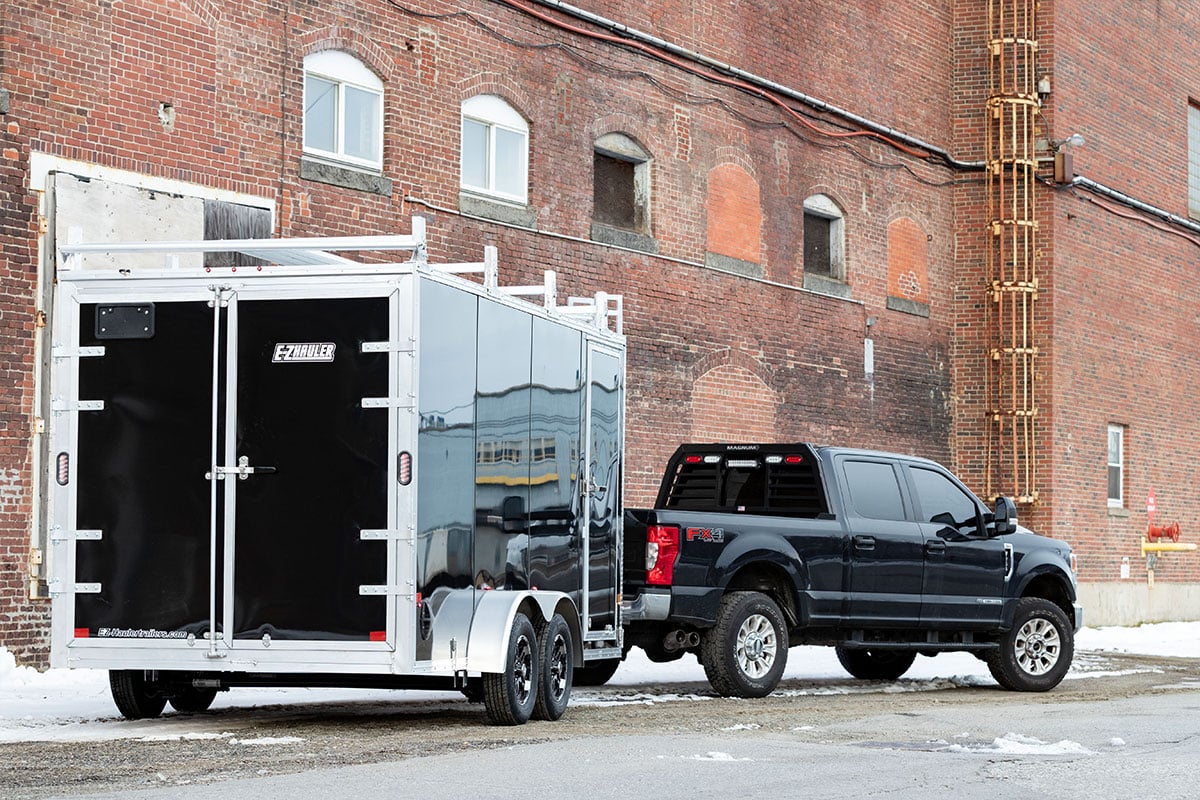 A shiny new ALCOM enclosed contractor trailer with durable Polycor AP siding