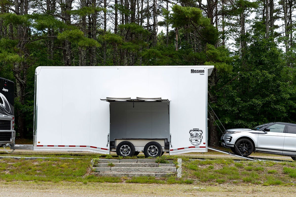 Mission Pinnacle series stacker car hauler parked and loading a vehicle.