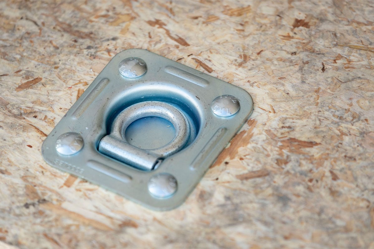 ALCOM recessed D-ring installed in water resistant decking in contractor trailer