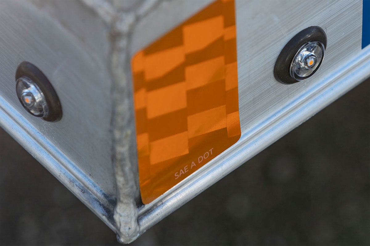 Marker lights on an open aluminum ALCOM trailer