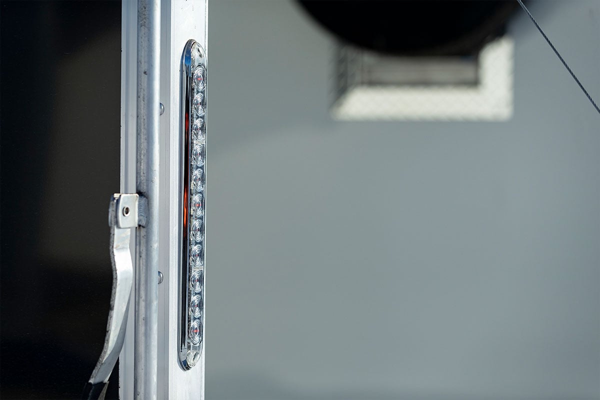 Slim brake and backup lights on the rear of an ALCOM aluminum trailer