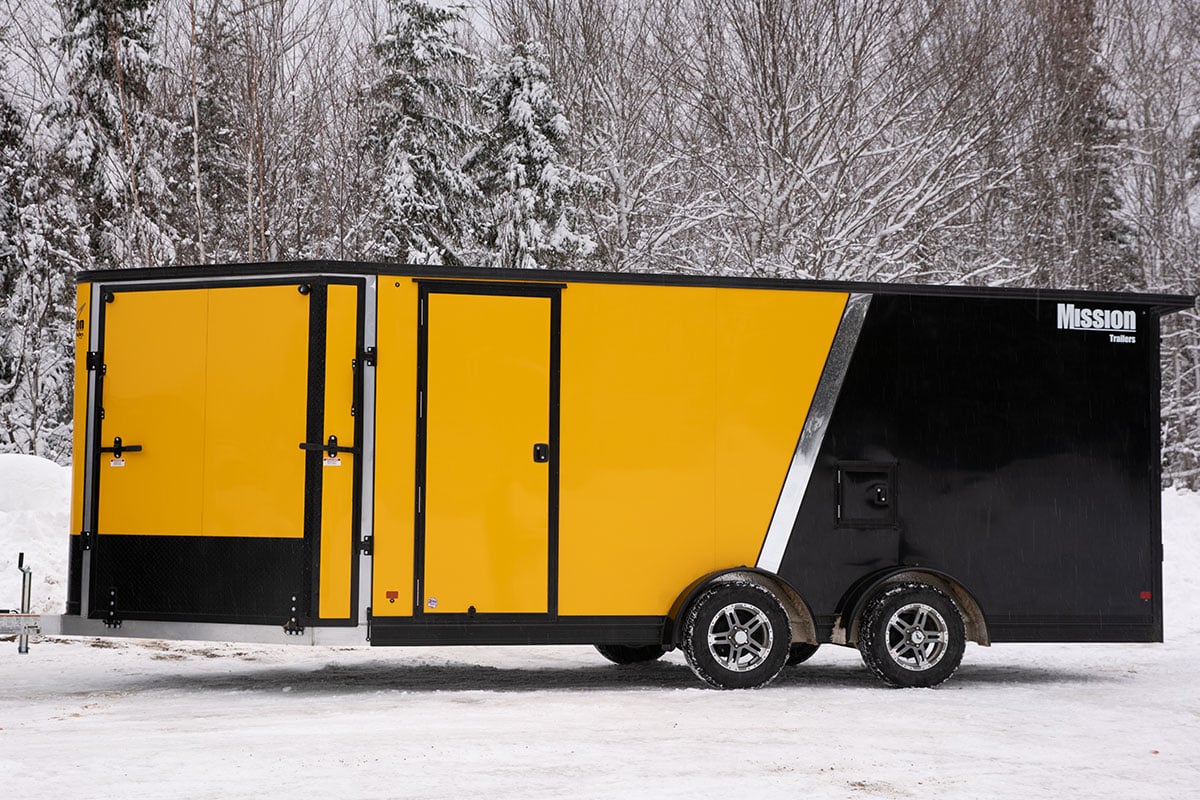 Side view of an enclosed snow trailer from ALCOM
