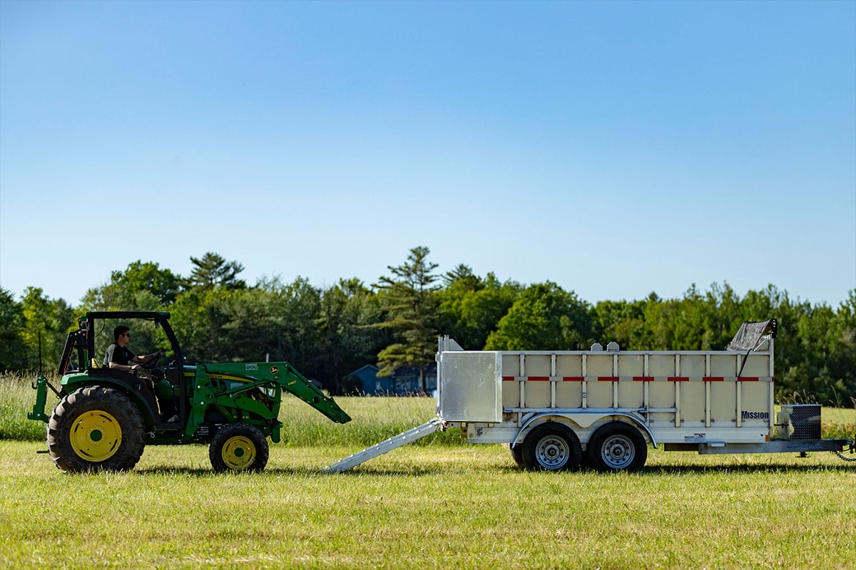 Ready to drive a tractor up the ramps into an ALCOM commercial dump trailer