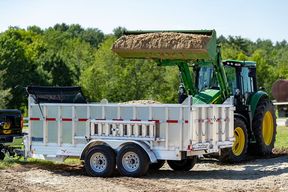 Alcom-Commercial-Dump-Trailers-3-loading-dirt-1