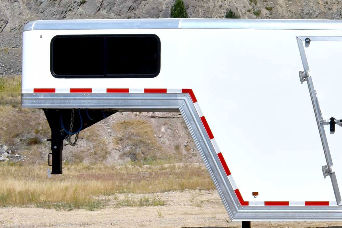 Gooseneck style enclosed aluminum car hauler by ALCOM