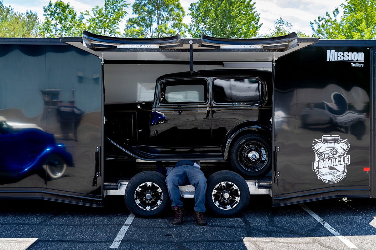 ALCOM enclosed Pinnacle car trailer, loaded, with elite escape doors open