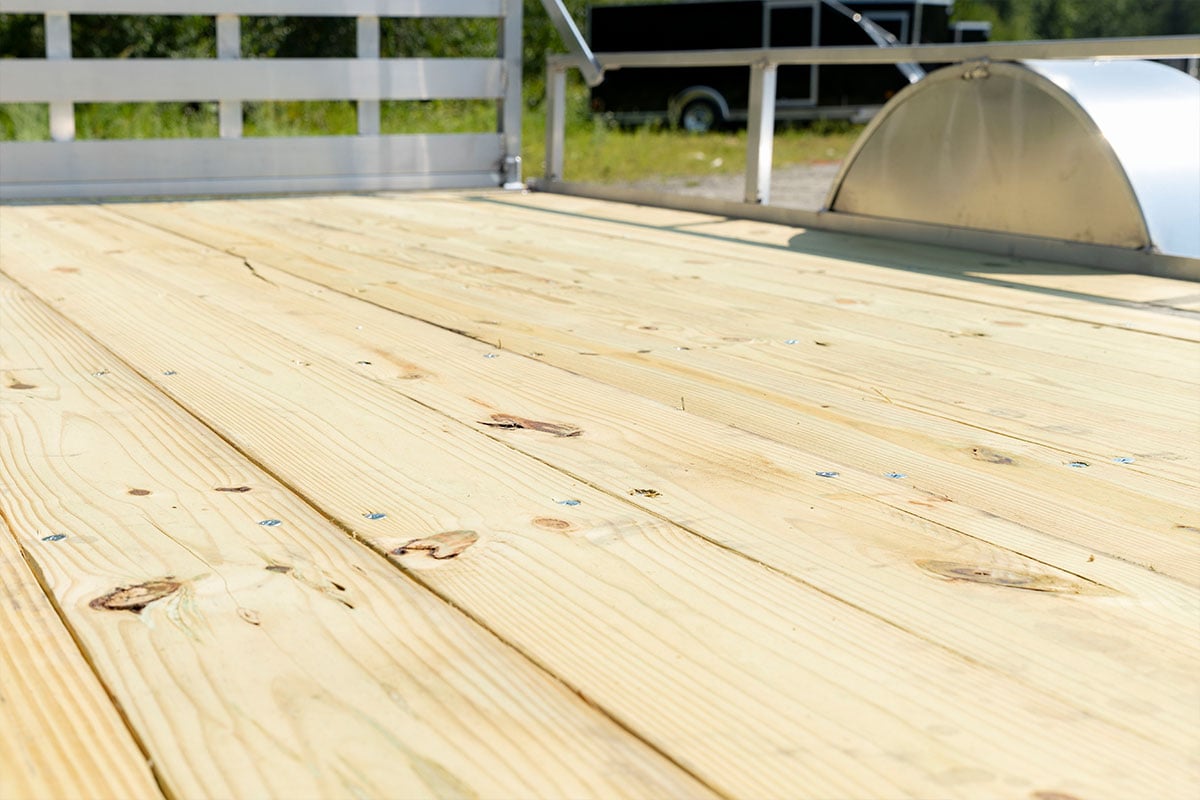 Heat treated plank deck on open ALCOM aluminum trailer 