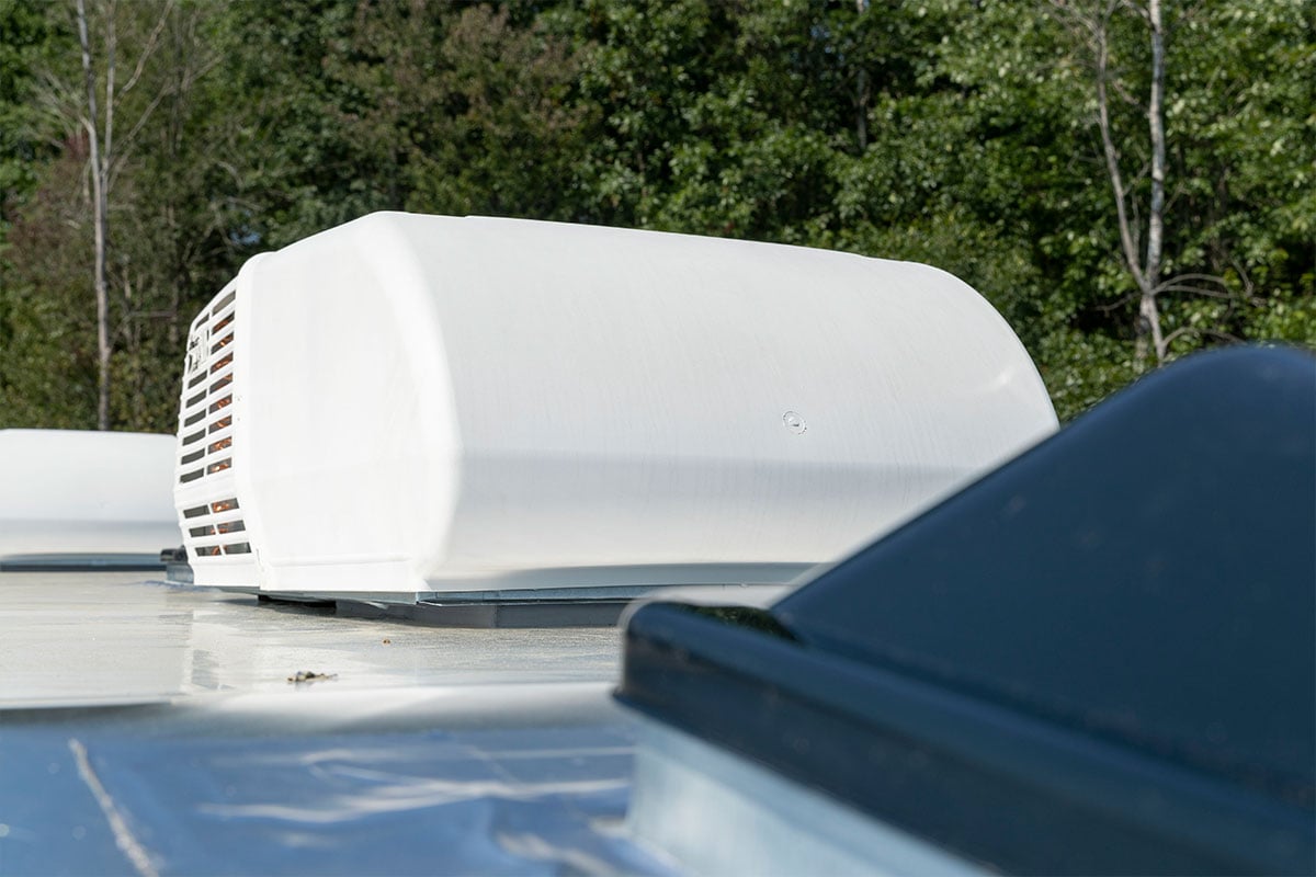 Roof-mounted AC unit on an enclosed ALCOM aluminum trailer
