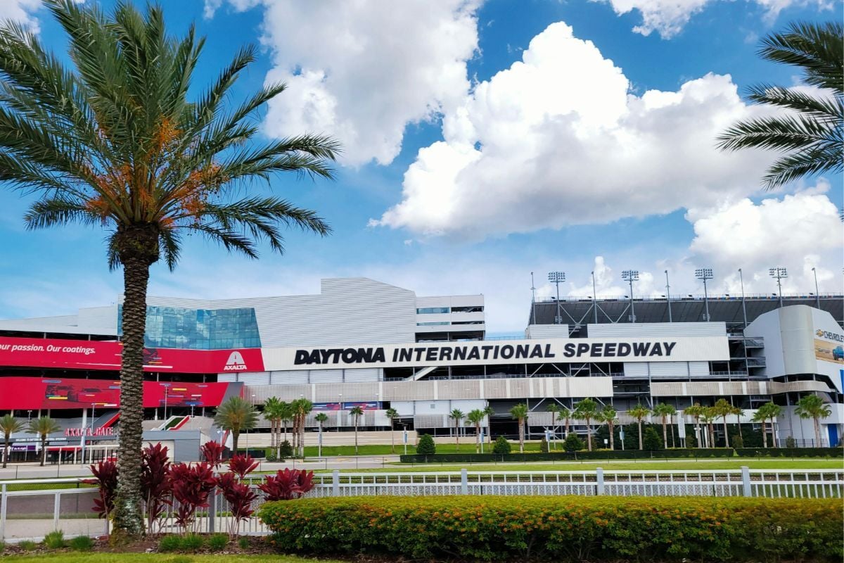Daytona International Speedway track and sign on a sunny day - Photo by Kristine Caballero