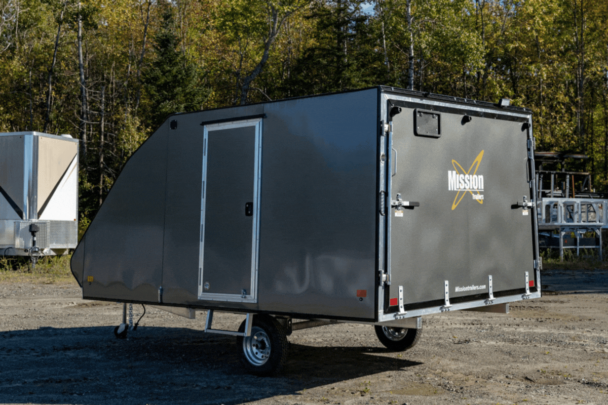 Mission crossover snowmobile trailer with ramp door closed then open