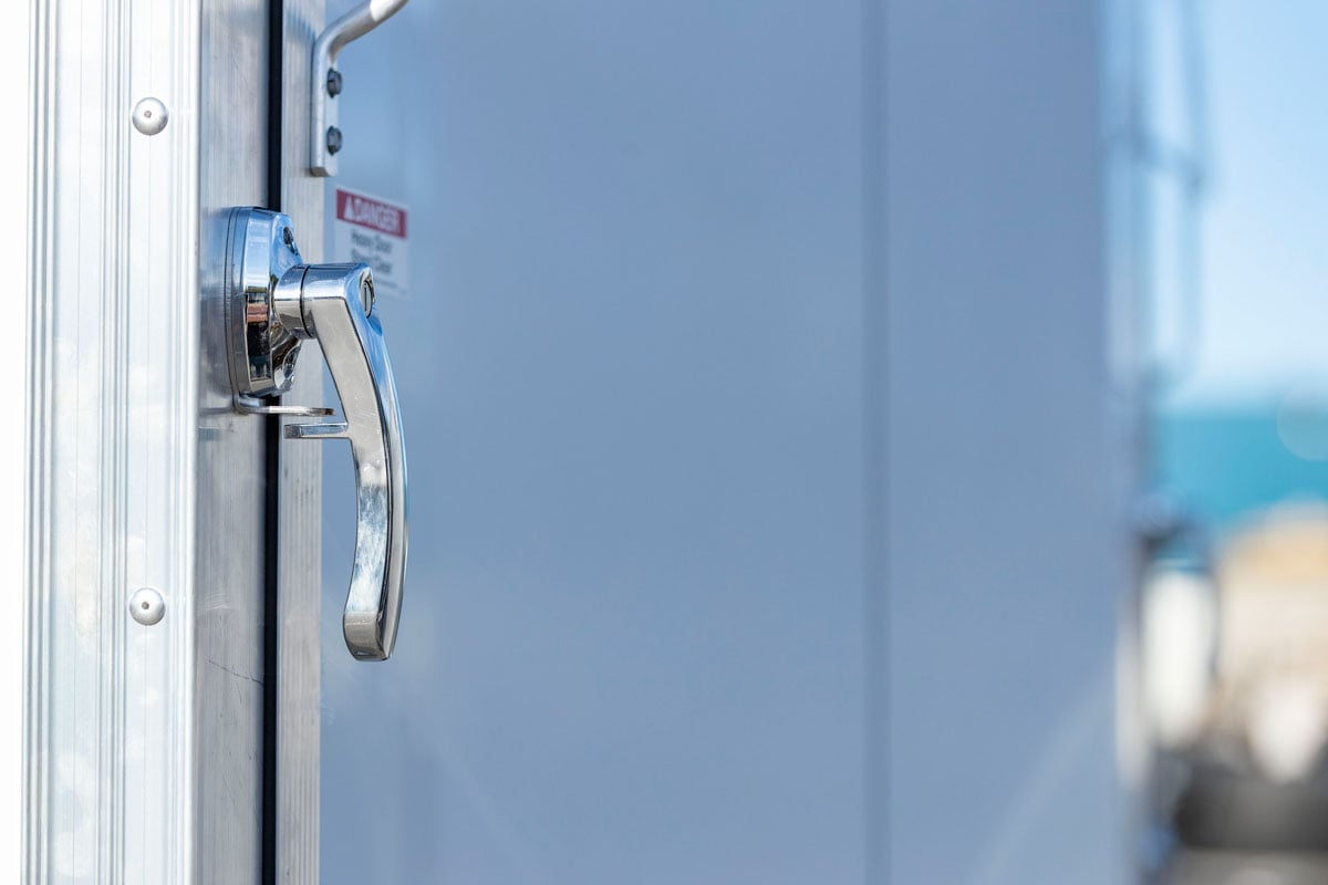 Freezer latch for rear ramp door of Pinnacle Series motorcycle trailer