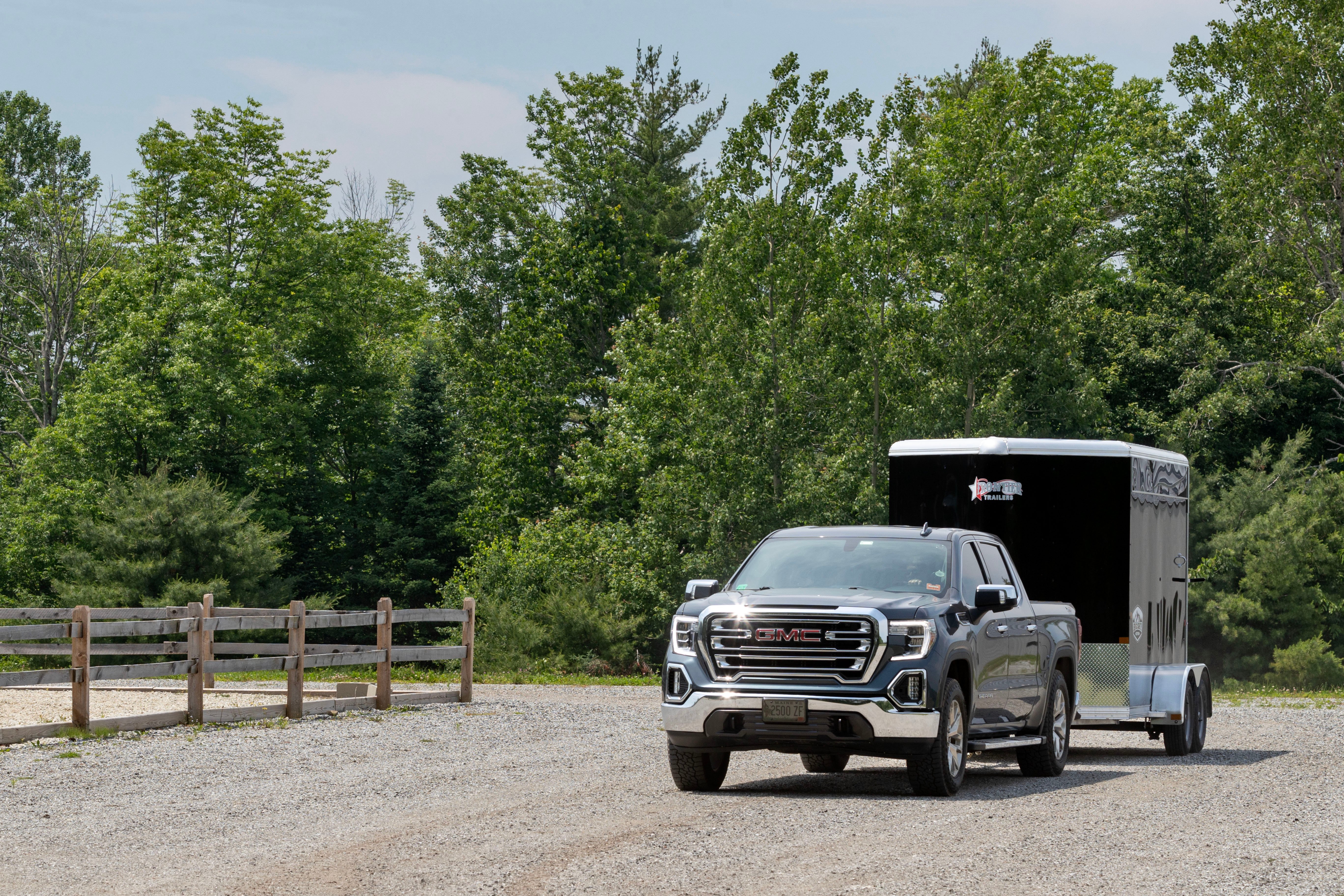 SUV towing a Frontier Colt Big Sky aluminum horse trailer on a sunny day