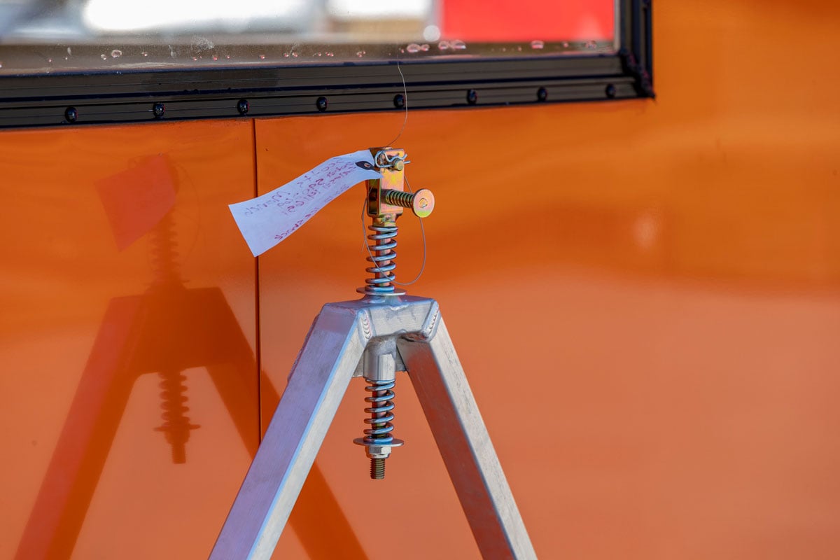 Spring-loaded tow hitch on ALCOM aluminum ice shack