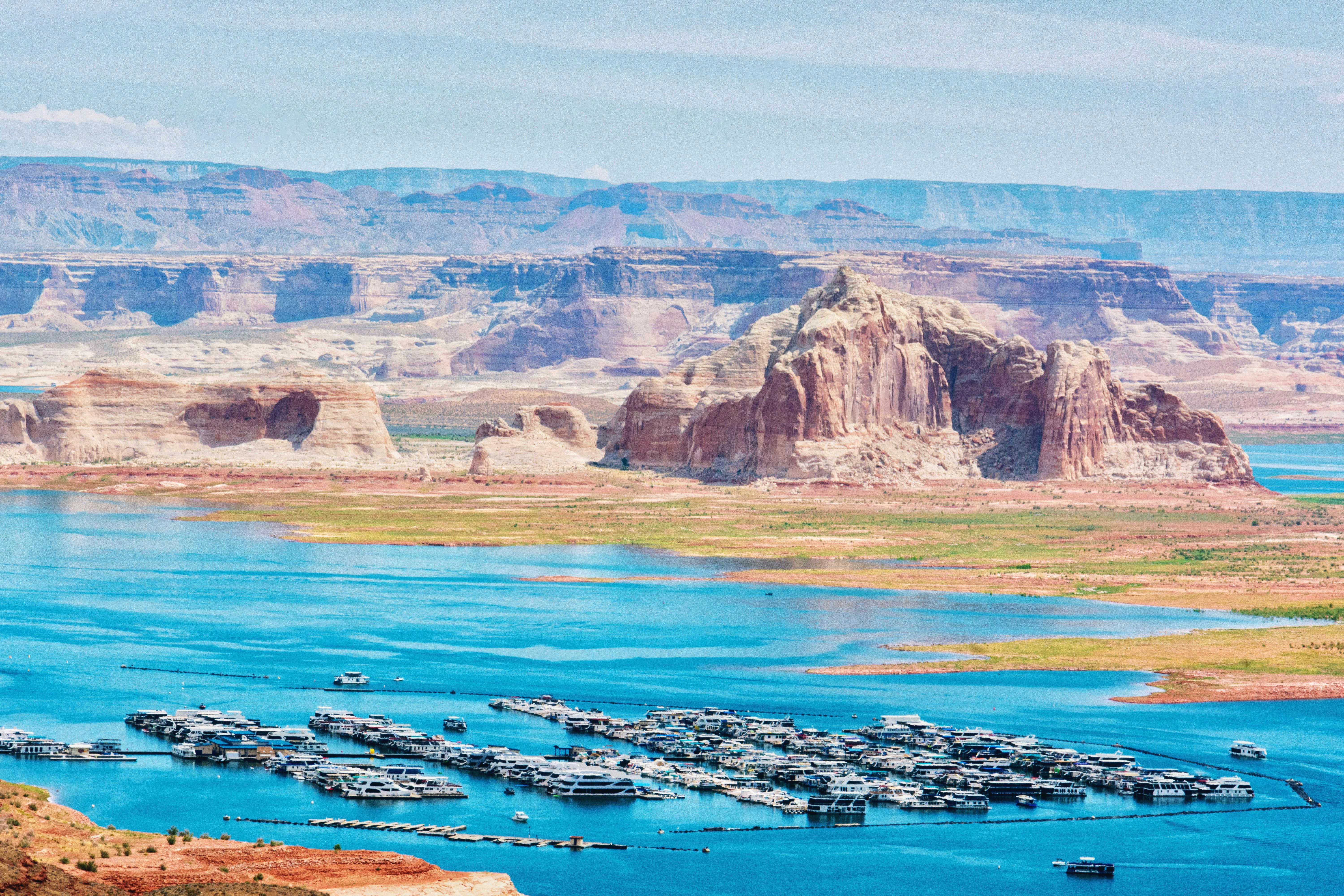 Aerial view of Lake Powell marina with canyon walls beyond - PC Kelly Chen 