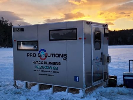A Mission aluminum ice shack with custom decal branding for Pro Solutions HVAC & Plumbing Contractors in Maine - PC Pro Solutions via Mission FB