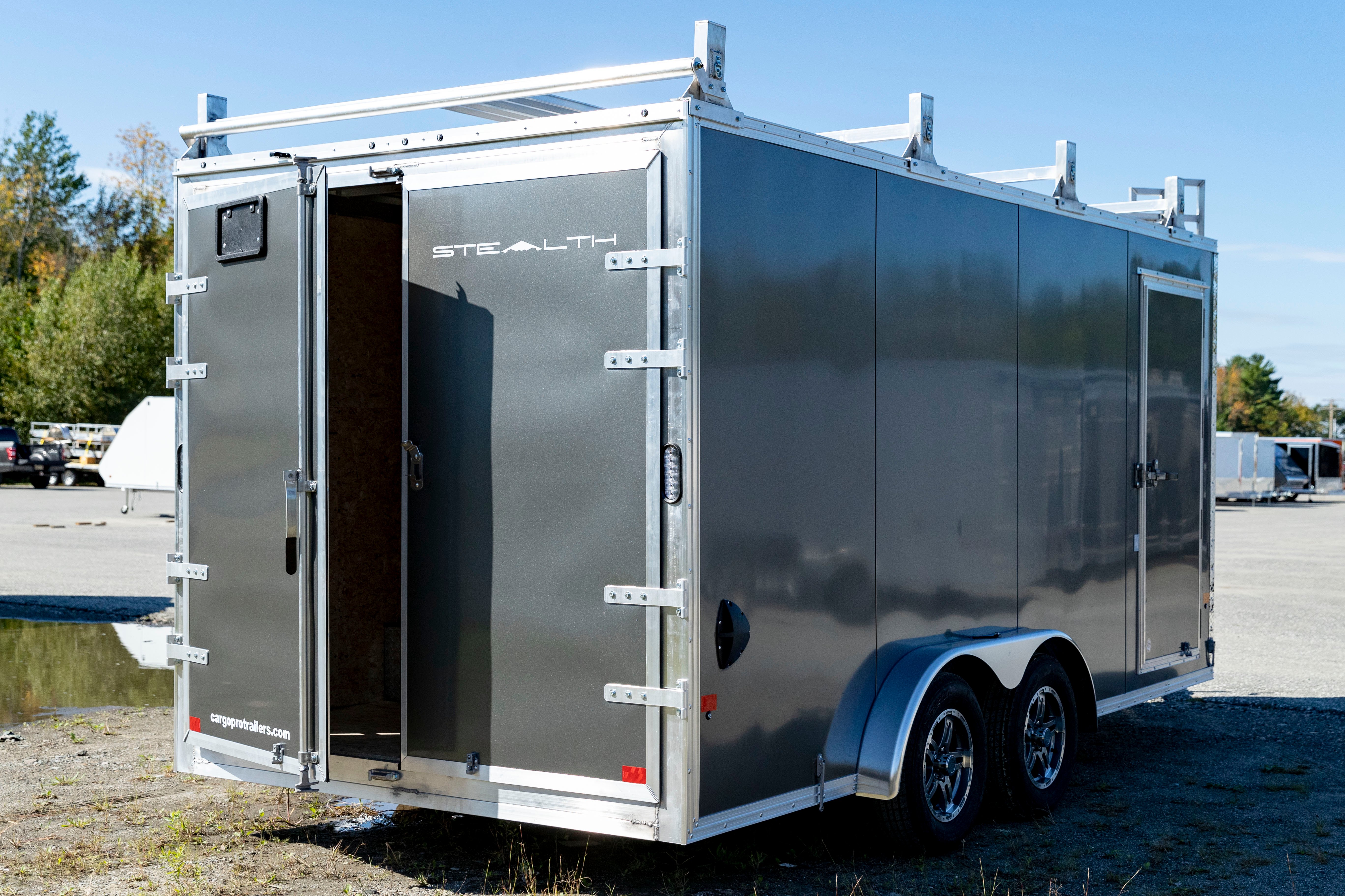 A gray Stealth enclosed ultimate contractor package shown with rear doors ajar