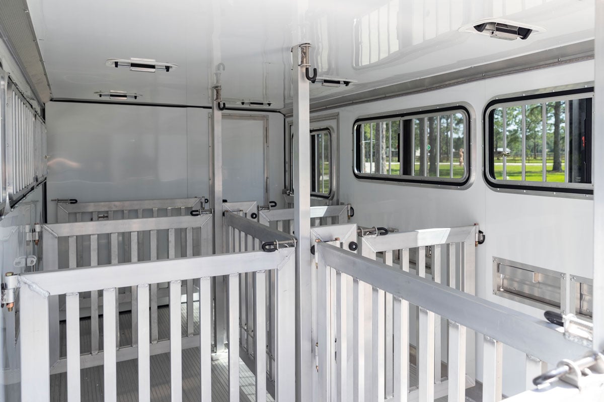 Adjustable stalls with spring latch system in a Stock LowPro DDFW trailer