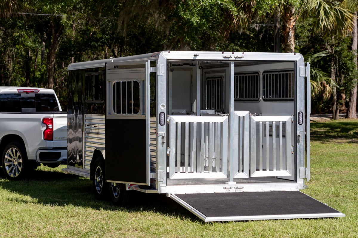 Frontier Stock LowPro DDFW Series bumper pull trailer with rear ramp and swing doors open