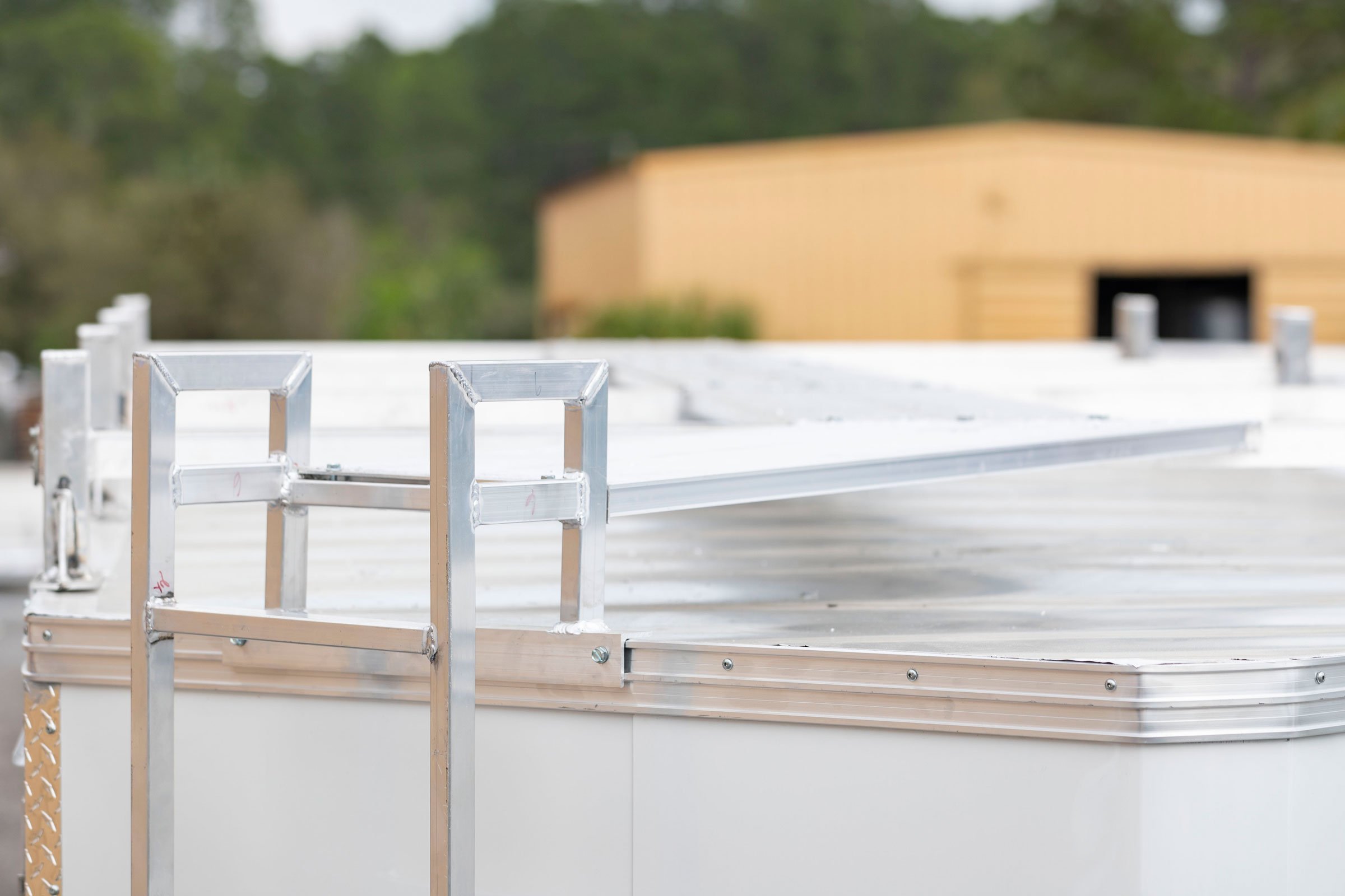 Ladder to roof and catwalk on a white ultimate contractor trailer