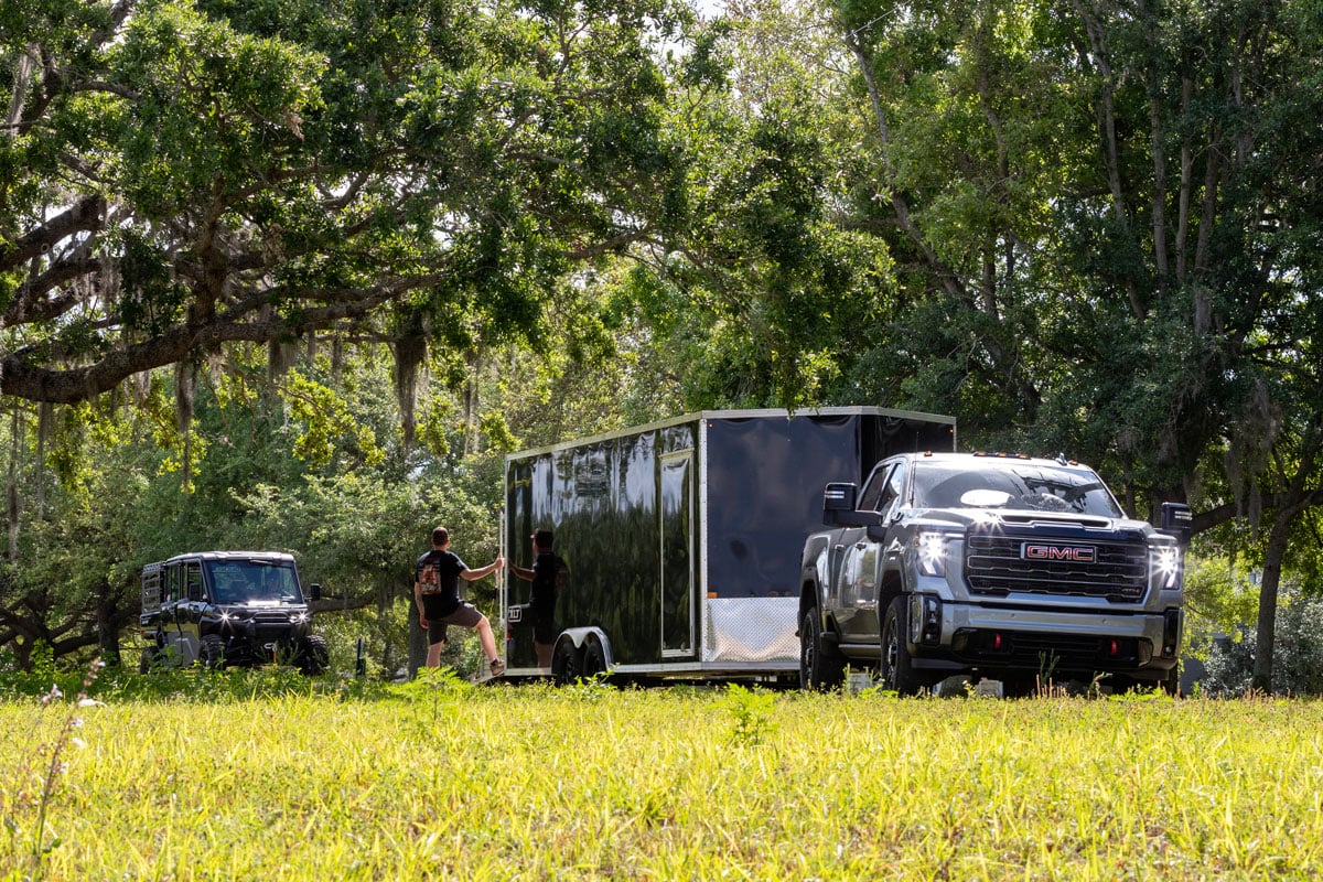 XLT Pro Series car hauler parked and ready for a UTV to load in using the rear ramp door