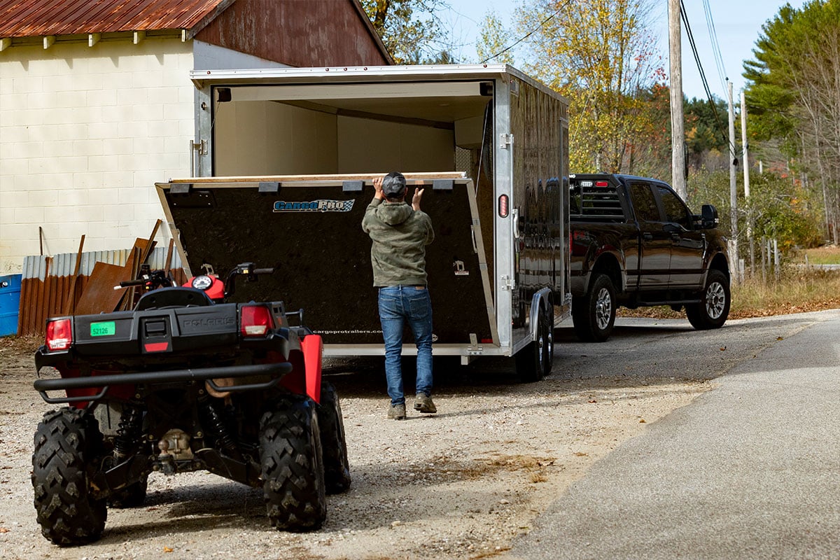 Opening the spring assisted rear ramp door of an ALCOM aluminum ATV trailer