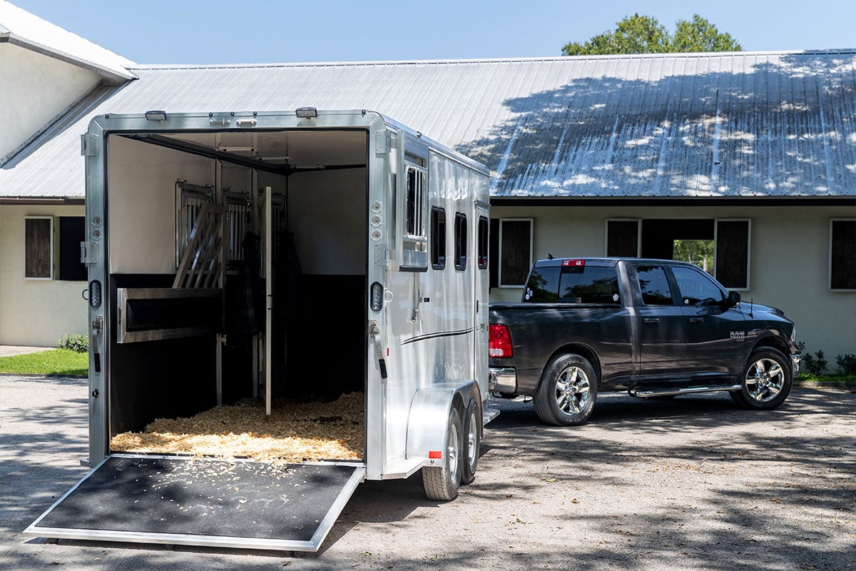 Open rear ramp on a white bumper pull Frontier aluminum horse trailer