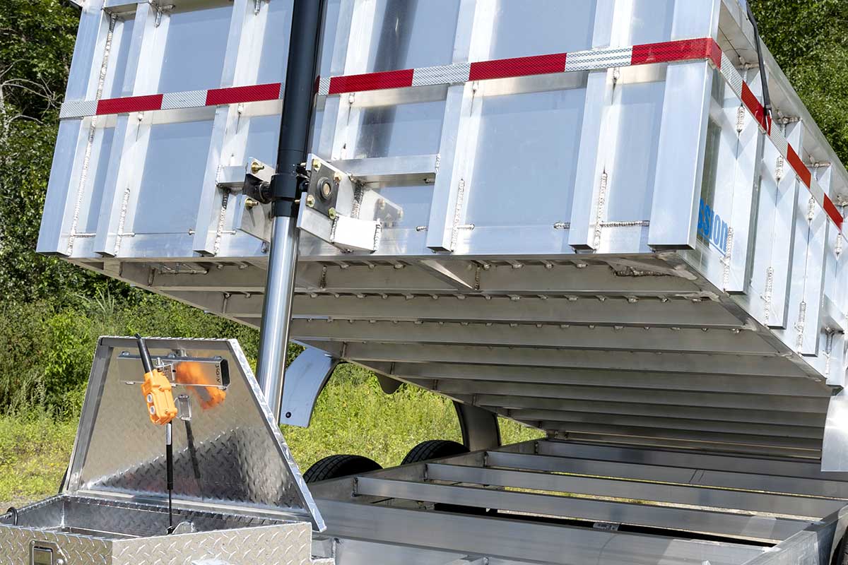 Commercial grade aluminum dump trailer with front hoist engaged