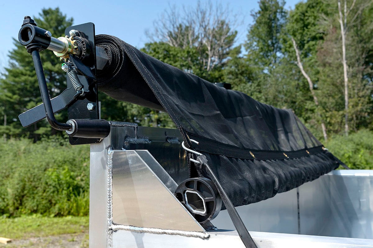 Canvas tarp covering system for an ALCOM commercial dump trailer