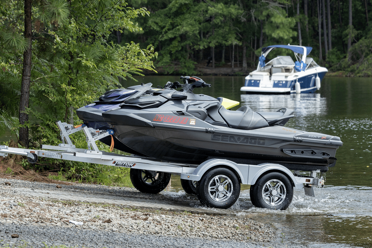 Two-place PWC trailer entering the lake for loading