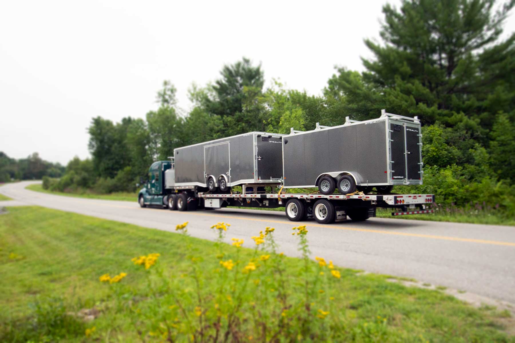 alcom_delivery_truck_loaded_with_trailers