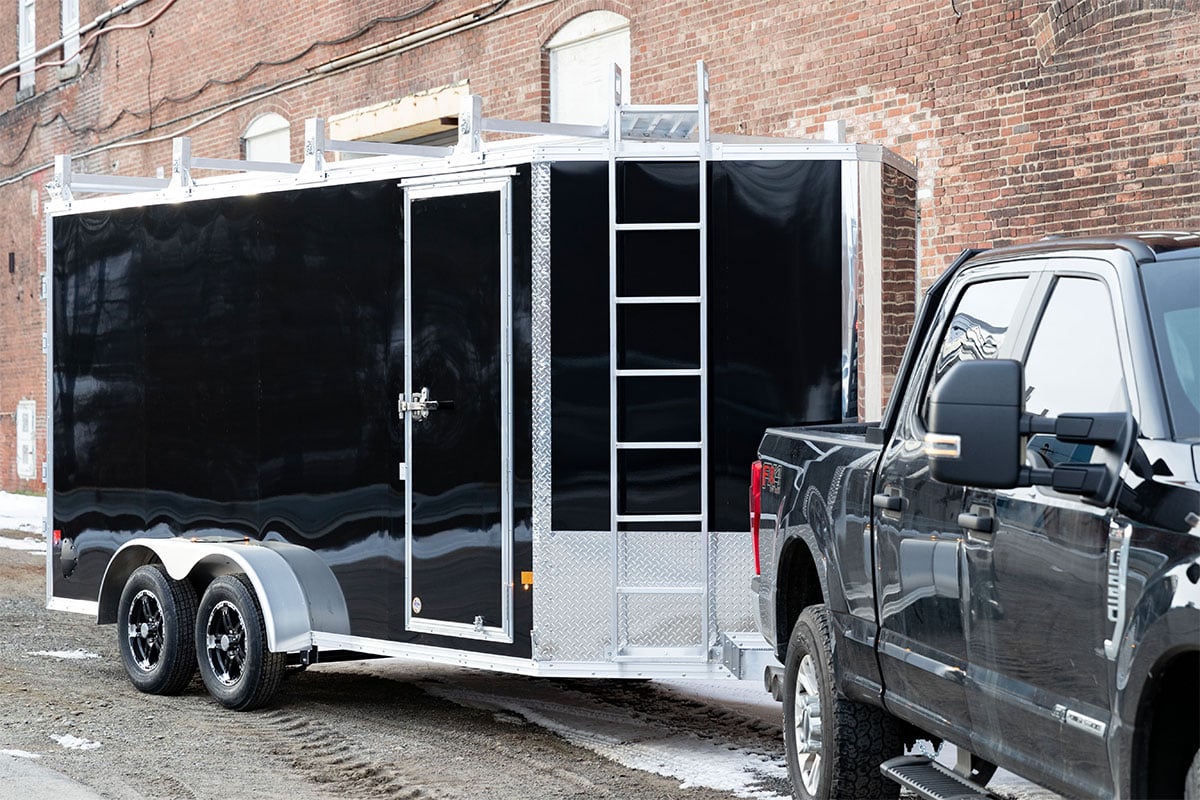 Sleek black Polycor AP trailer siding on an ALCOM aluminum enclosed contractor trailer
