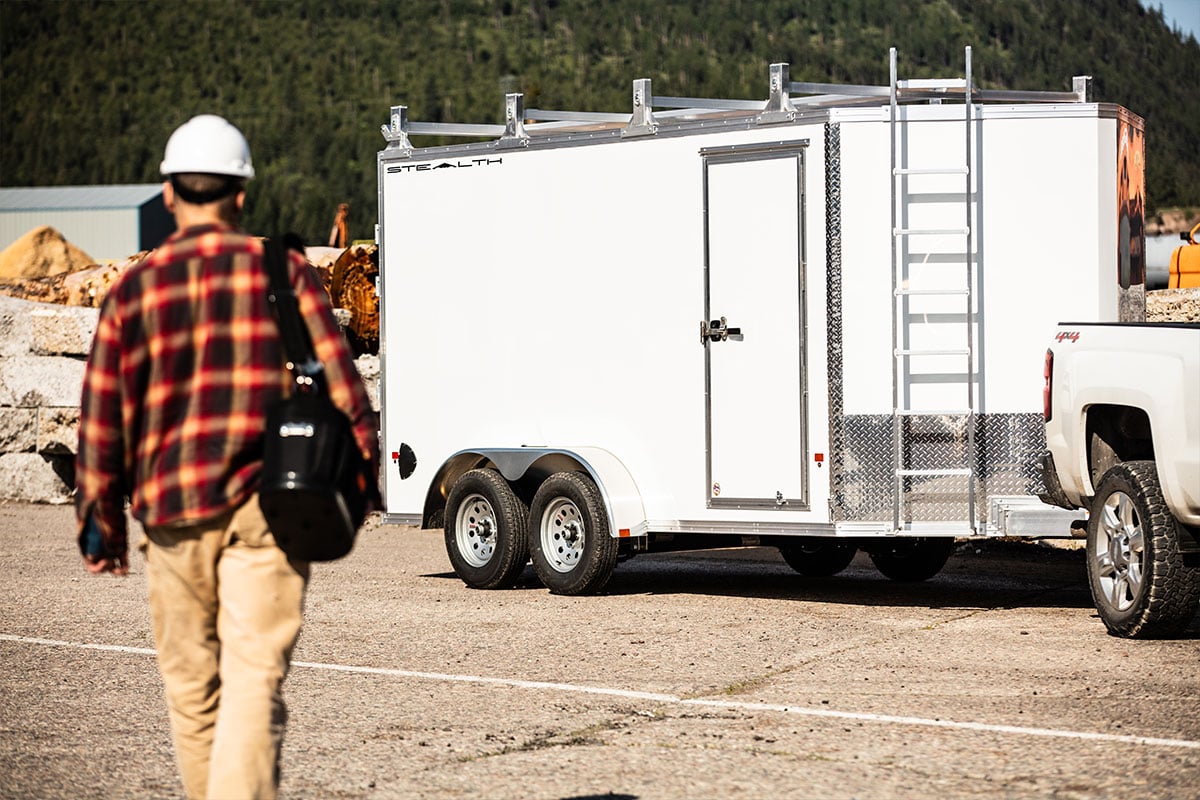 ALCOM aluminum enclosed contractor trailer with side door and ladder to roof