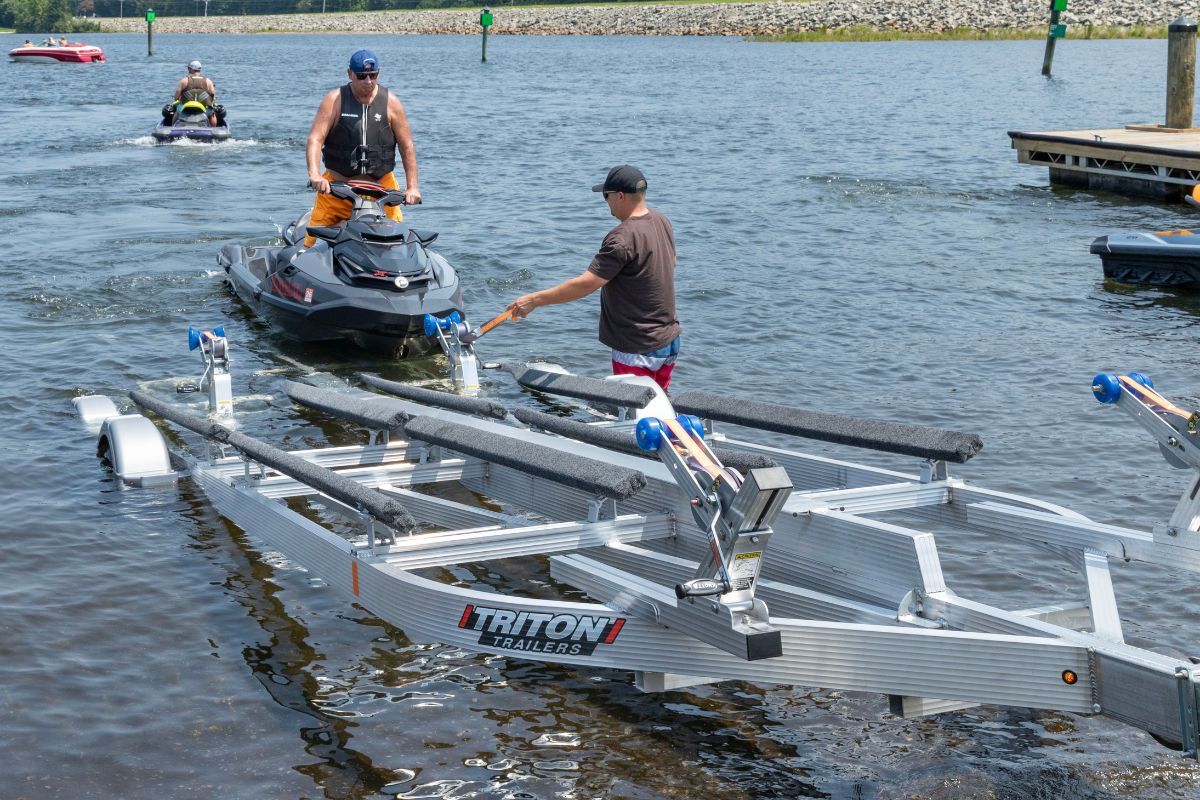 4 place PWC trailer on the boat ramp ready to load
