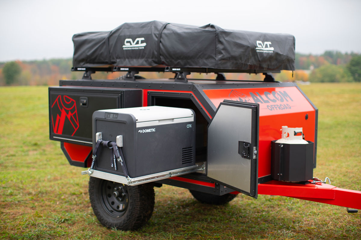 The AO Trailers Spur offroad camper has a pull-out Dometic fridge and rooftop tent